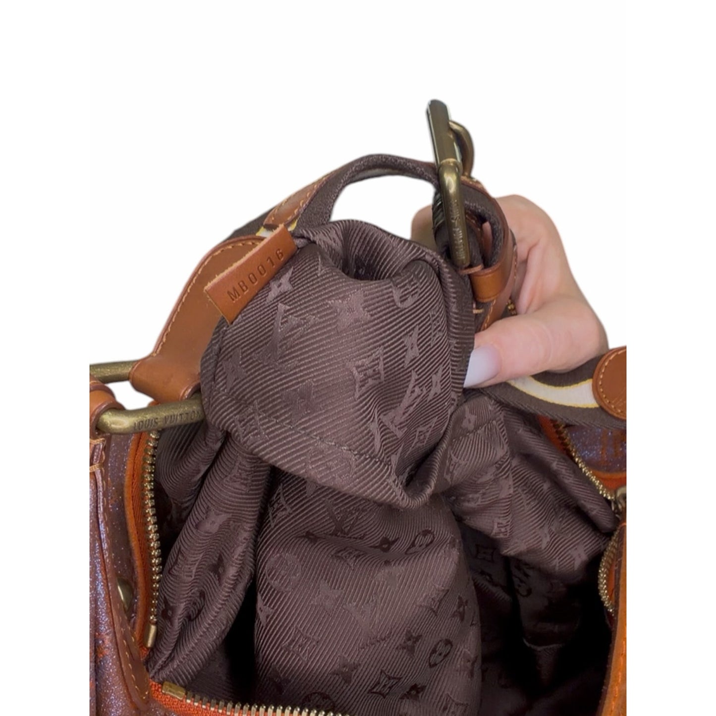 LOUIS VUITTON Runway 
Limited Edition Metallic Leather Onatah GM Bag