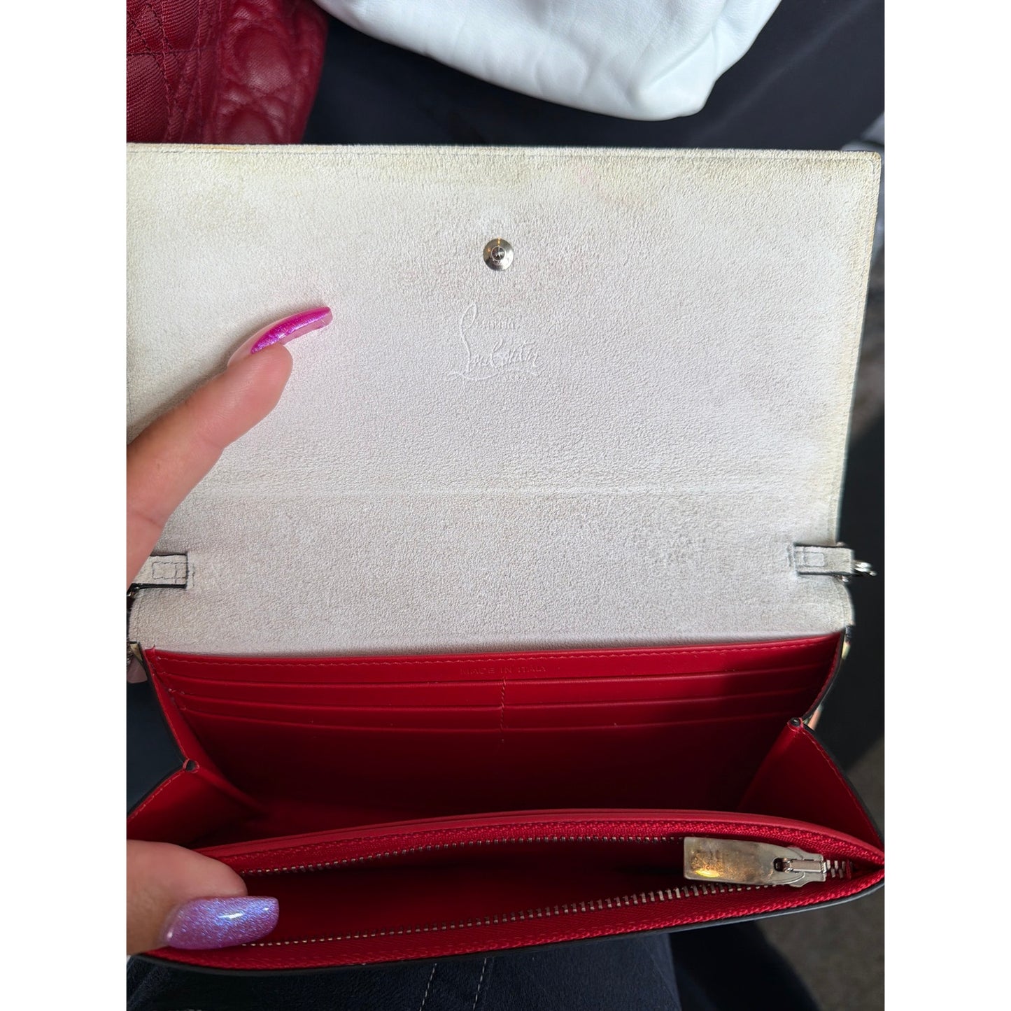 Christian Louboutin So Kate clutch features a vibrant multicolored geometric print on patent leather