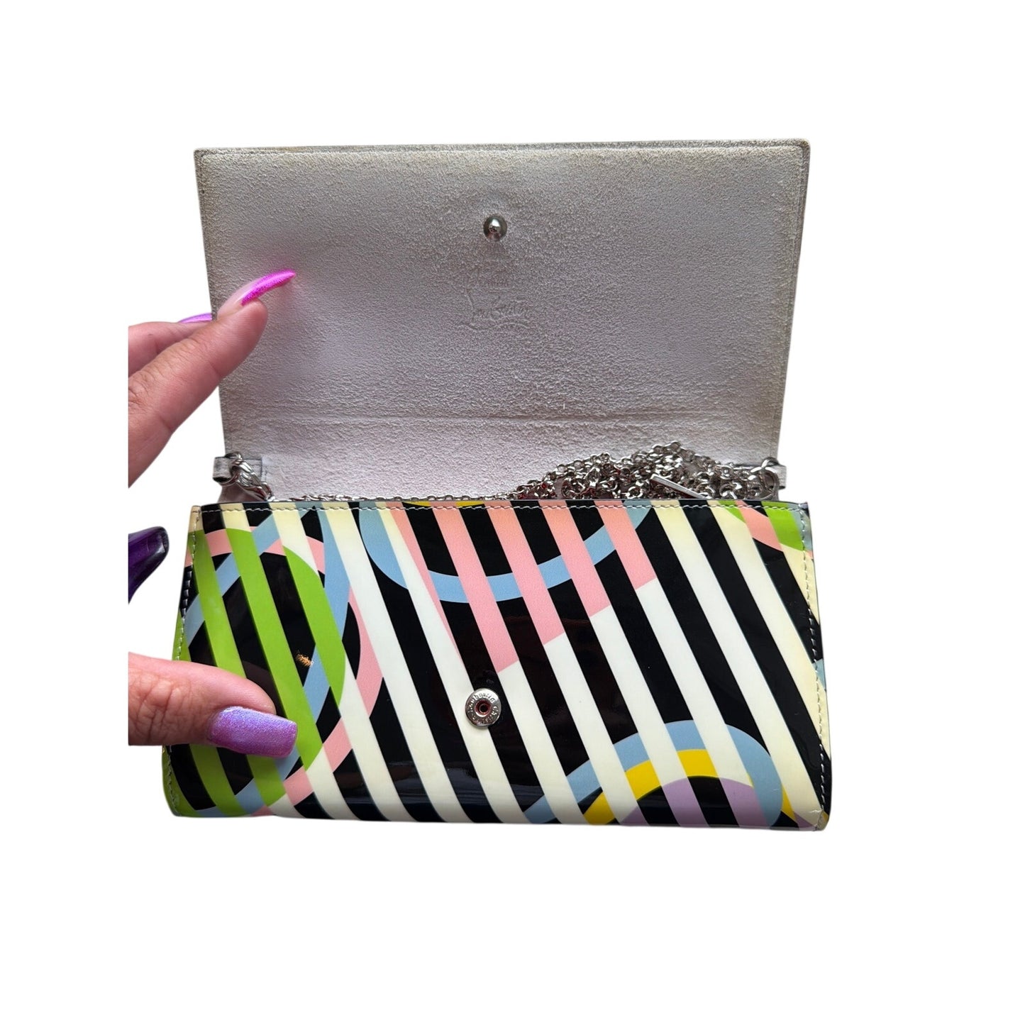 Christian Louboutin So Kate clutch features a vibrant multicolored geometric print on patent leather