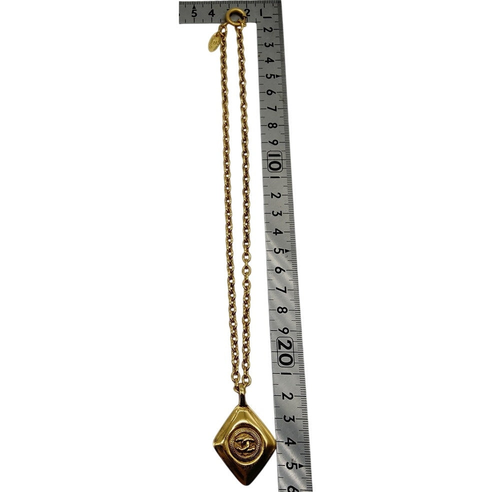 Chanel Vintage Coco Mark necklace with a Rhombus Pendant gold-plated metal.